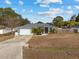 House exterior with gray siding and double garage at 35 Teak Rd, Ocala, FL 34472