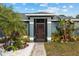 Inviting front entrance with screened porch and landscaping at 35 Teak Rd, Ocala, FL 34472