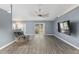 Living room with gray walls, wood-look floors, and a recliner at 35 Teak Rd, Ocala, FL 34472