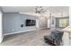 Spacious living room with gray walls and wood-look floors at 35 Teak Rd, Ocala, FL 34472