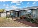 Covered patio with seating area, perfect for outdoor relaxation at 35 Teak Rd, Ocala, FL 34472