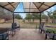 Relaxing patio area with seating under a gazebo at 35 Teak Rd, Ocala, FL 34472