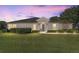 Charming single-story home featuring well-maintained landscaping and a beautiful lawn at 7066 Sw 91St Ct, Ocala, FL 34481