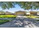 House exterior with driveway and landscaping at 7066 Sw 91St Ct, Ocala, FL 34481