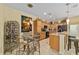 Open kitchen with island, pendant lighting, and adjacent dining area perfect for entertaining at 7066 Sw 91St Ct, Ocala, FL 34481