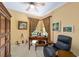 Inviting home office featuring wood furniture, ample lighting, and a comfortable chair at 7066 Sw 91St Ct, Ocala, FL 34481