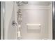 Walk-in shower with multiple shower heads and storage shelf at 7066 Sw 91St Ct, Ocala, FL 34481