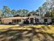 Charming one-story home featuring lush landscaping, a welcoming entrance, and an attached two-car garage at 7535 Sw 185 Avenue Rd, Dunnellon, FL 34432
