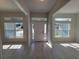 Bright and airy foyer with tile floors and multiple windows at 7587 Sw 103Rd Loop, Ocala, FL 34476