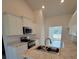 Modern kitchen with white cabinets and granite countertops at 7587 Sw 103Rd Loop, Ocala, FL 34476