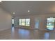 Spacious living room with tile floors and multiple windows at 7587 Sw 103Rd Loop, Ocala, FL 34476