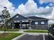 Exterior view of community clubhouse with open-air seating and manicured landscaping at 8357 Sw 58Th Ave, Ocala, FL 34476
