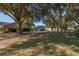 View of homes and landscape with large shade trees at 8625 Sw 94Th Ln # G, Ocala, FL 34481