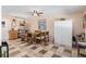 Bright dining area features a rustic wooden table and a tile floor at 8625 Sw 94Th Ln # G, Ocala, FL 34481