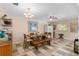 Spacious dining area with wood table, bench seating, and tile flooring at 8625 Sw 94Th Ln # G, Ocala, FL 34481