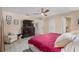 Main bedroom with king bed, dresser, and ceiling fan at 8625 Sw 94Th Ln # G, Ocala, FL 34481