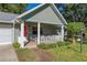 Covered porch with white railings, and seating area at 8625 Sw 94Th Ln # G, Ocala, FL 34481