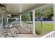 Relaxing covered porch with comfortable seating at 8625 Sw 94Th Ln # G, Ocala, FL 34481