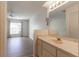 Bathroom with single sink vanity and bedroom view at 2444 Se 18Th Cir, Ocala, FL 34471