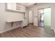 Bedroom with wood-look floors and mirrored closet doors at 2444 Se 18Th Cir, Ocala, FL 34471