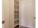 Spacious closet with built-in shelving and hanging rod at 2444 Se 18Th Cir, Ocala, FL 34471