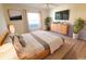 Main bedroom with dresser, large bed, and modern decor at 2444 Se 18Th Cir, Ocala, FL 34471