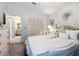 Bright bedroom with a walk-in closet and doorway to the ensuite bathroom at 9805 Sw 190Th Terrace Rd, Dunnellon, FL 34432