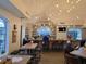 Lounge bar area with tables, chairs, and pendant lights, creating a stylish atmosphere for residents to unwind at 10975 Sw 69Th Cir, Ocala, FL 34476