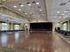 Large ballroom with hardwood floors and chandeliers at 10975 Sw 69Th Cir, Ocala, FL 34476