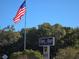 Oak Run Country Club entrance with American flag at 10975 Sw 69Th Cir, Ocala, FL 34476