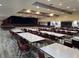 A spacious and well-lit area with tables and chairs arranged for community events and gatherings at 10975 Sw 69Th Cir, Ocala, FL 34476