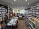 A library with rows of books, tables and chairs, providing a quiet area for reading and relaxation at 10975 Sw 69Th Cir, Ocala, FL 34476