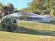 Community swimming pool, perfect for cooling off, includes lounge chairs and tables for relaxing by the pool at 10975 Sw 69Th Cir, Ocala, FL 34476