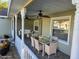 Virtually staged porch with seating and dining area at 10975 Sw 69Th Cir, Ocala, FL 34476