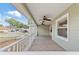 Covered porch with ceiling fans and view of neighborhood at 10975 Sw 69Th Cir, Ocala, FL 34476