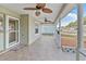 Front porch with tile flooring and ceiling fans at 10975 Sw 69Th Cir, Ocala, FL 34476