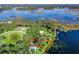 Aerial view showcasing a house on a spacious lot near the lake at 11754 Se 123Rd St, Belleview, FL 34420