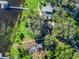 Bird's-eye view of a lakefront home and neighborhood at 11754 Se 123Rd St, Belleview, FL 34420