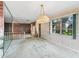 Spacious dining area with a chandelier and a view to the living room at 11754 Se 123Rd St, Belleview, FL 34420