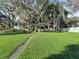 Lakefront property with a spacious yard and mature trees at 11754 Se 123Rd St, Belleview, FL 34420