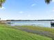 Stunning lake view with a dock and lush vegetation at 11754 Se 123Rd St, Belleview, FL 34420