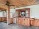 Rustic outdoor bar with sink and storage at 11754 Se 123Rd St, Belleview, FL 34420