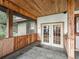 Screened porch entry with French doors and tile flooring at 11754 Se 123Rd St, Belleview, FL 34420