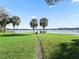 Beautiful waterfront property with grassy area and dock at 11754 Se 123Rd St, Belleview, FL 34420