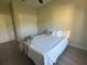 Bright bedroom featuring wood floors, a ceiling fan, and a large closet at 12205 Sw 71St Lane Rd, Ocala, FL 34481