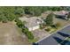 Spacious property featuring a large home, lush greenery, and a three car garage at 17819 Sw 61St Lane Rd, Dunnellon, FL 34432