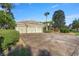 Beautiful home showcasing a brick driveway, a three-car garage, and lush landscaping at 17819 Sw 61St Lane Rd, Dunnellon, FL 34432