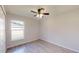 Simple bedroom with tile floors and a window at 232 Locust Pass, Ocala, FL 34472