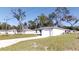 Newly built home with a one-car garage and well-manicured lawn at 232 Locust Pass, Ocala, FL 34472