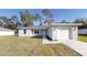 Newly constructed home with a one-car garage and a well-manicured lawn at 232 Locust Pass, Ocala, FL 34472